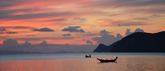 Two boats on the sea during sunset